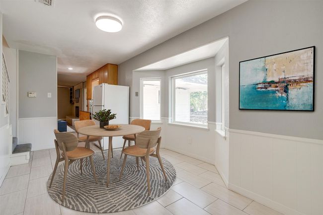 Bright breakfast area with a beautiful bay window overlooking the backyard. Images are virtually staged. | Image 18