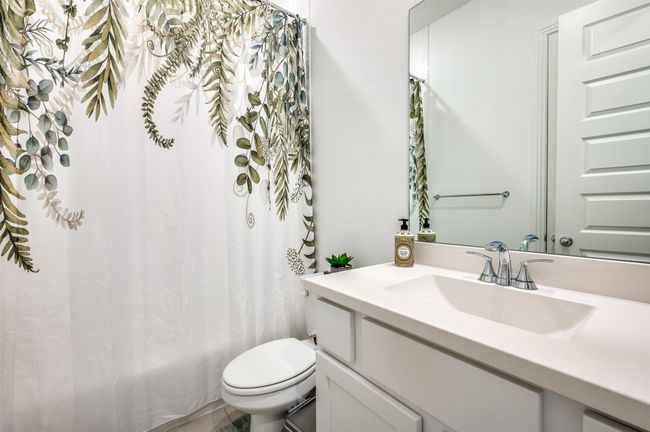 Bathroom with vanity and shower / tub combo with curtain | Image 17