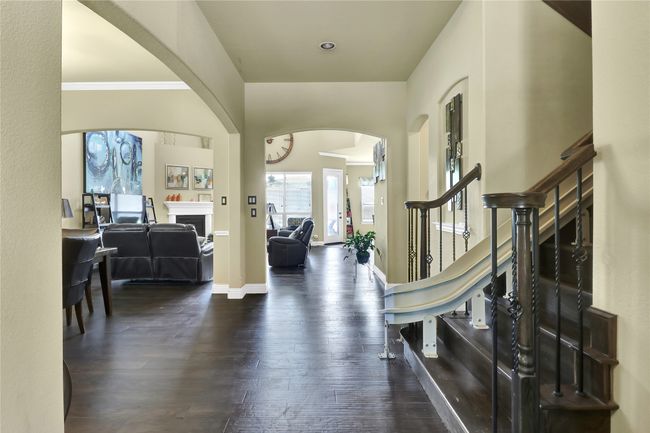 Entry showing open floor plan between, kitchen, living room and dining space. | Image 13