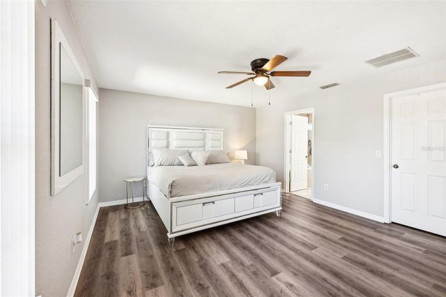 Primary Bedroom with Ensuite Bath and Walk-in Closet | Image 17