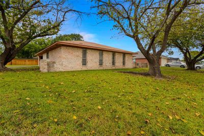 View of property exterior featuring a lawn | Image 2