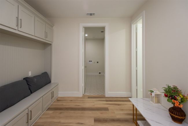 Mudroom with light wood-type flooring | Image 30