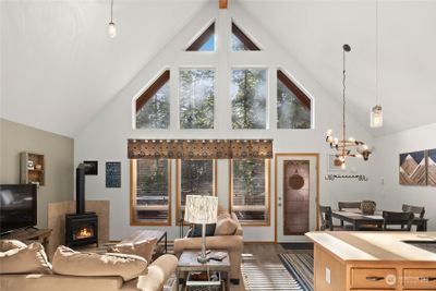 Wall of windows and vaulted ceilings make the great room light and bright. | Image 2