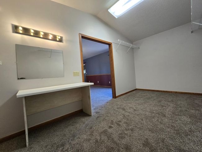 Spacious walk in closet with light vanity! | Image 32