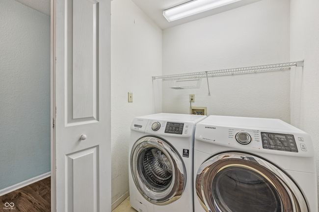 washroom featuring separate washer and dryer and wood finished floors | Image 19