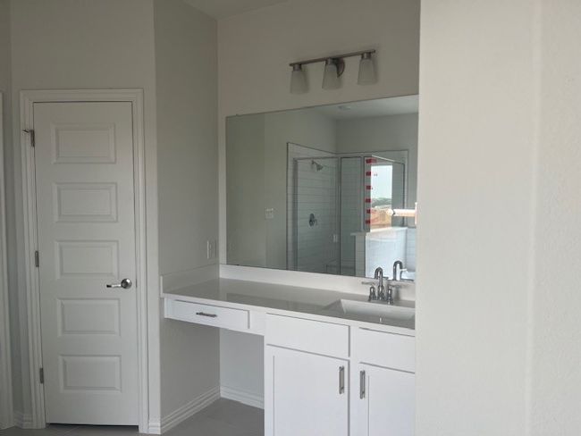 Full bathroom with a shower stall and vanity | Image 8