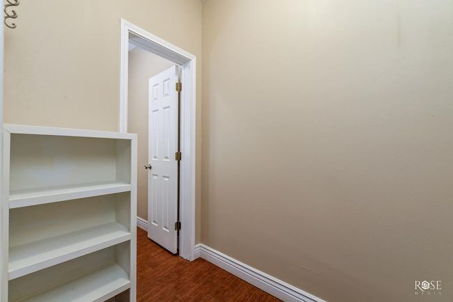 hallway leading towards half bath | Image 37