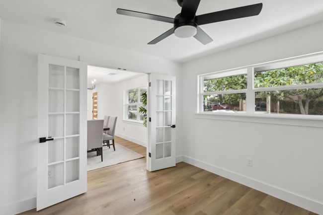 Office with french doors, baseboards, a healthy amount of sunlight, and wood finished floors | Image 9