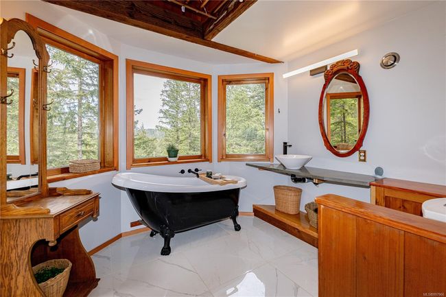 Main Bathroom with heated tile floors, laundry closet, pully drying racks and access to the outside bathroom (not included in bathroom count) | Image 43