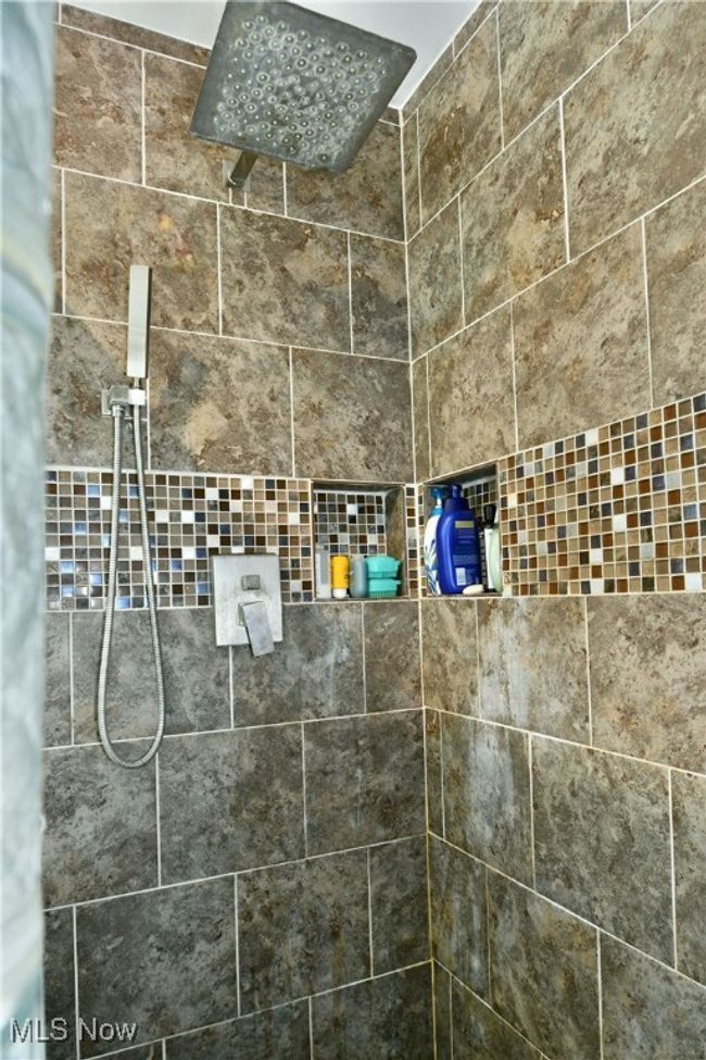 Interior details with a tile shower | Image 40