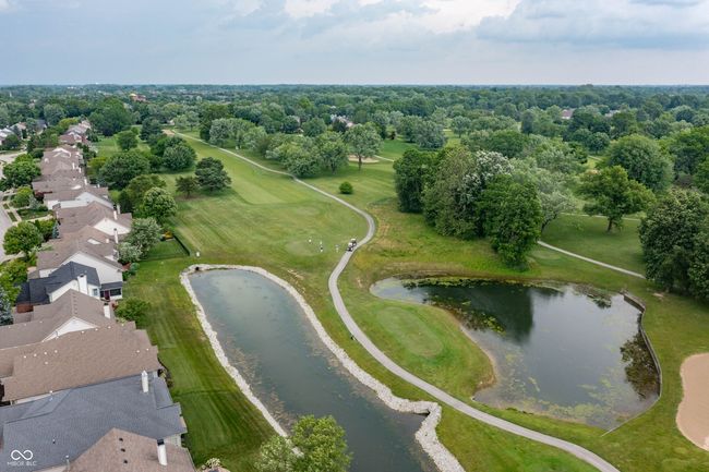 aerial view of residential area with a nearby body of water | Image 37