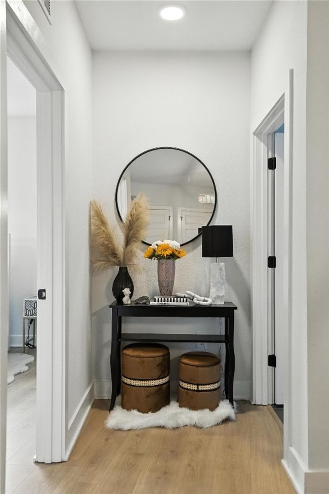Detailed view of wood finished floors and recessed lighting | Image 11