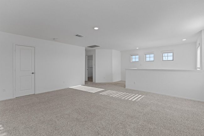 Empty room featuring light colored carpet, visible vents, and recessed lighting | Image 20
