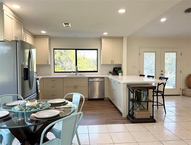 Custom cabinets feature soft-close hardware and pull out drawers | Image 8