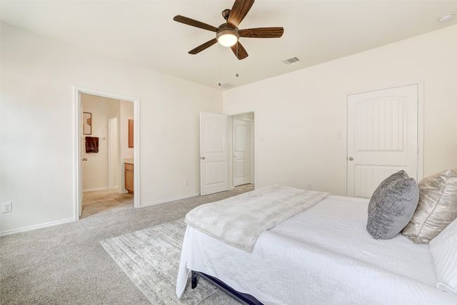 Primary bedroom with access to the primary bath | Image 24