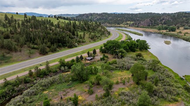 Aerial view of property and surrounding area with a water and mountain view and a forest | Image 37