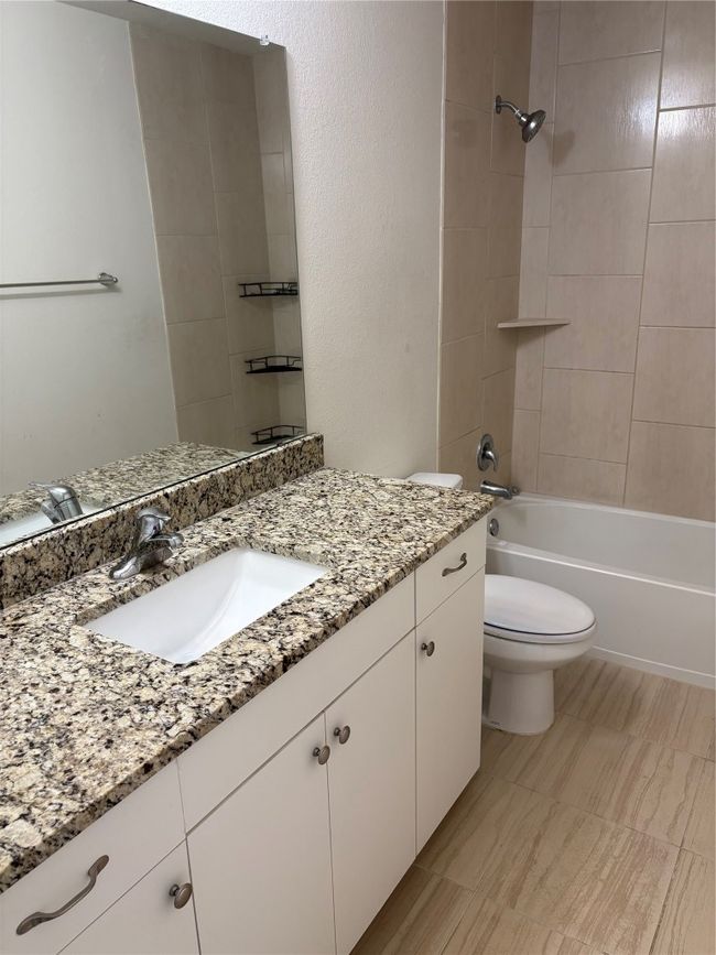 Full bath with vanity, toilet, and shower combination | Image 8