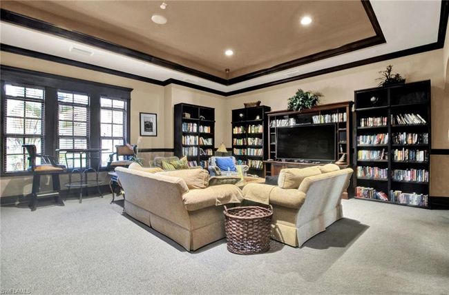 Living room with carpet, crown molding, a raised ceiling, and recessed lighting | Image 43