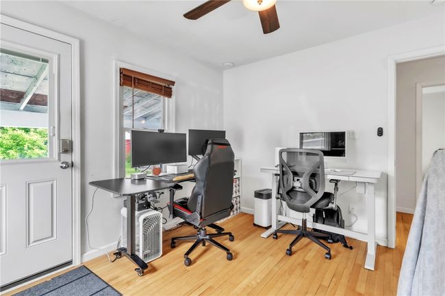 2nd bedroom, currently used for office, with access to back patio | Image 18