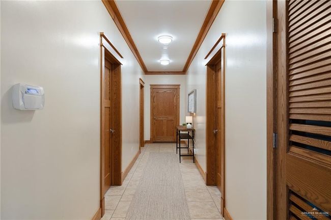 Corridor featuring light tile patterned floors and ornamental molding | Image 15