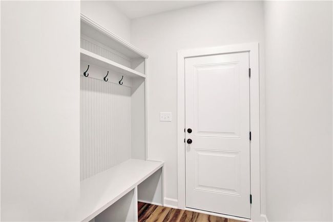 Mudroom featuring baseboards and wood finished floors | Image 23