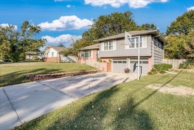 View of front of home with a front yard and a garage | Image 2