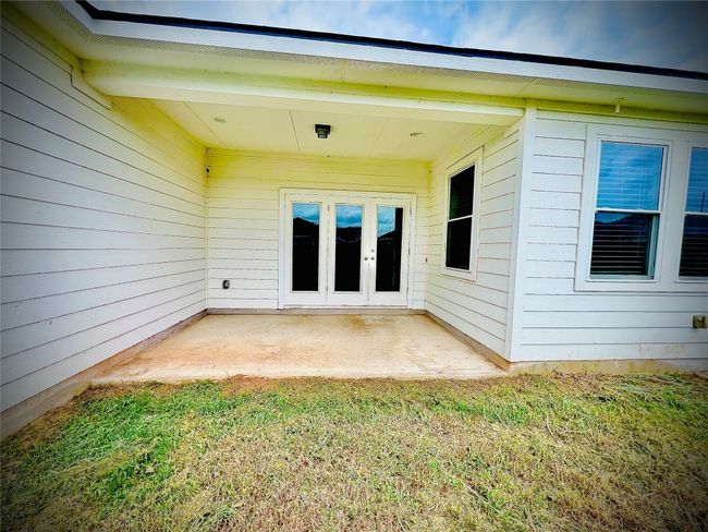 Spacious covered patio with room for your outdoor furniture. | Image 17