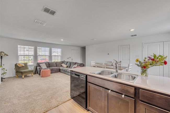 Kitchen featuring dishwasher, recessed lighting, light countertops, and light wood finished floors | Image 18