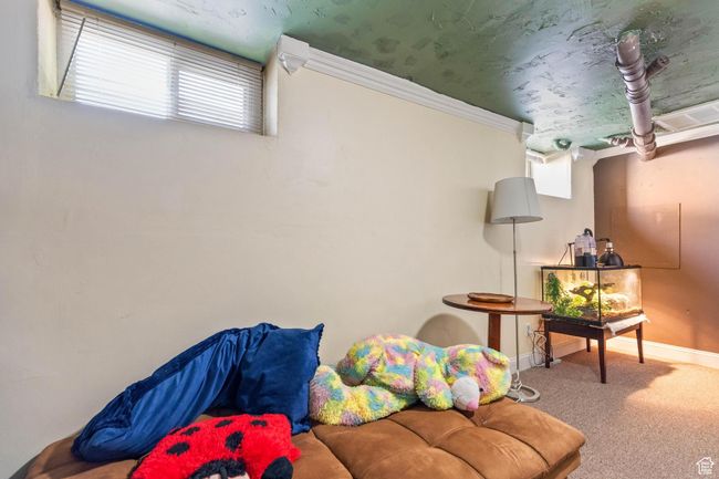 Sitting room with carpet flooring, baseboards, and crown molding | Image 18