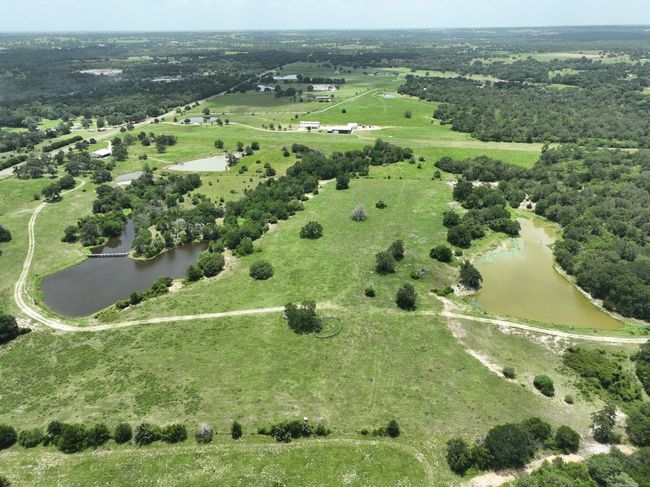 Overview of rural landscape with a nearby body of water | Image 11