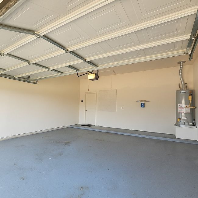 Spacious garage with easy to clean epoxy floors | Image 34