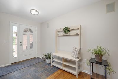 Lited door with sidelight and slate flooring create an inviting entrance | Image 3