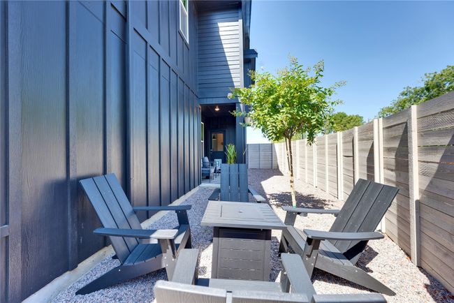 View of patio with a fire pit and a fenced backyard | Image 35