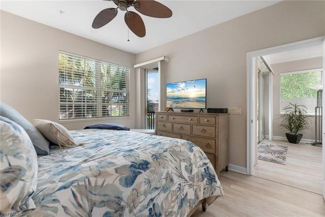 Bedroom with ceiling fan and light hardwood / wood-style floors | Image 9