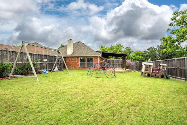 View of fenced backyard | Image 35