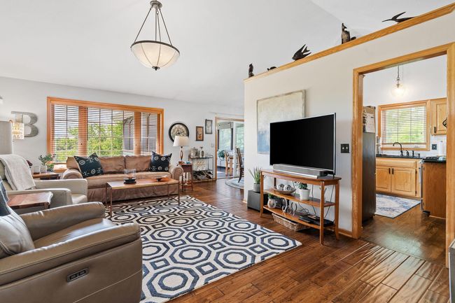 This view greets you as you enter the home-check out these sensational solid wood floors! | Image 17