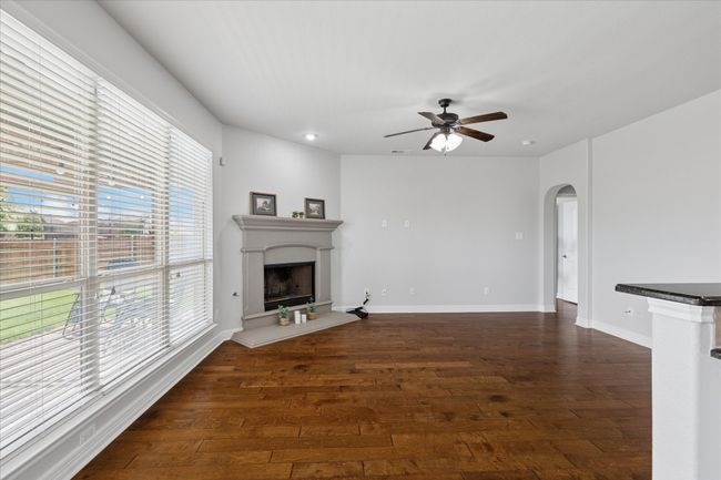 Living Room with wood floors and open to kitchen | Image 9