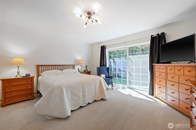 Primary bedroom with private sliding glass door leading to you own patio and hot tub out back. | Image 25