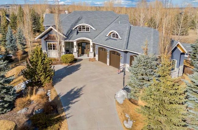 36 Mackenas Way, Home with 5 bedrooms, 4 bathrooms and 6 parking in Rural Rocky View County AB | Image 1