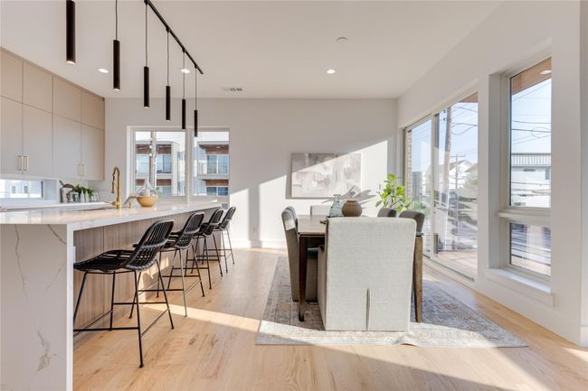 Dining space featuring sink and light hardwood / wood-style flooring | Image 15