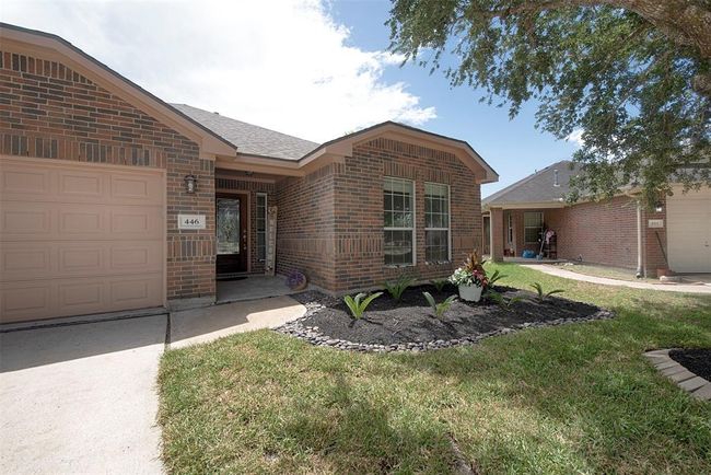 Inviting walkway to the front door and lovely freshly mulched garden. | Image 4