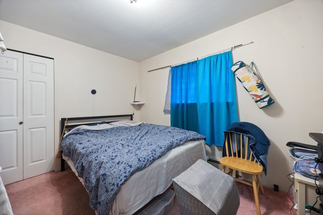 Bedroom with a closet and carpet floors | Image 34