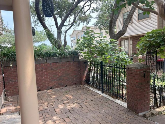 There is beautiful solar lighting that illuminates this space in the evening. Don't you want to just enjoy an evening beverage in this shady space? | Image 11