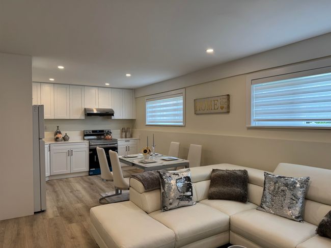 Living room with light wood-type flooring and recessed lighting | Image 25