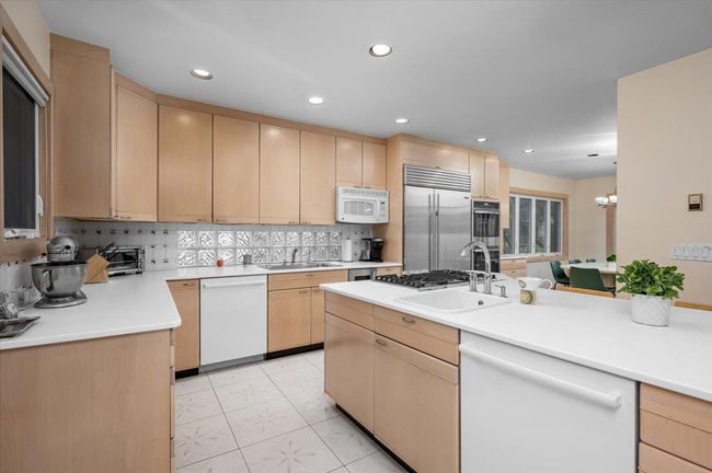 Chefs Kitchen with light countertops, recessed lighting, stainless steel appliances | Image 6