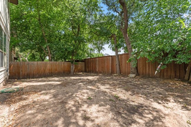 View of fenced backyard | Image 22