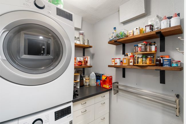 Laundry room also serves as a large walk-in pantry | Image 14