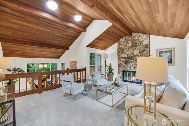 Spacious living room with vaulted ceiling is open to the formal dining room. Perfect for entertaining | Image 5