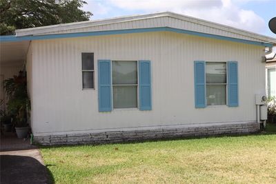 Front of the home, carport is to the side. | Image 1