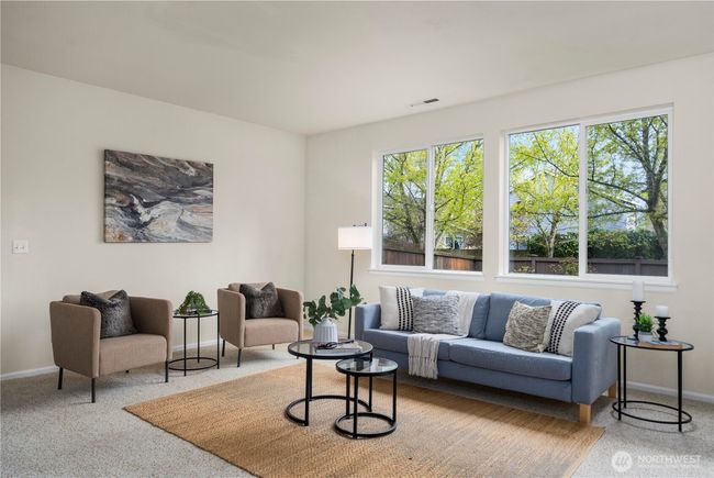 The living room is massive and is open to the large kitchen + dining room | Image 6